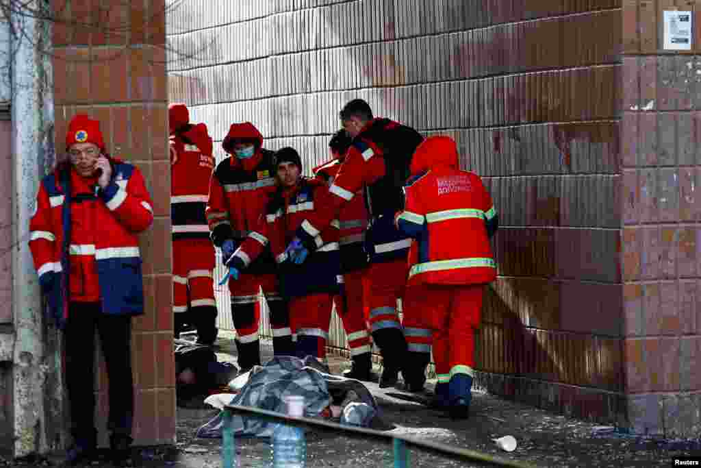 Emergency personnel collected bodies of residents killed in the apartment building.