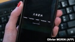 An illustration picture shows the ANoM logo displayed on the screen of an smartphone on june 8, 2021 in Paris.