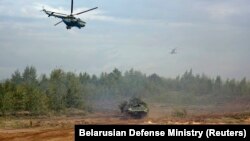 Helicopters and an armored vehicle participate in the Zapad (West) 2017 war games on September 14.