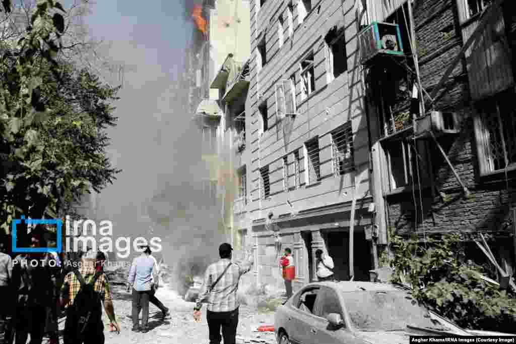 An apartment building burns following an Israeli strike on central Tehran on June 15.