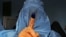 Afghanistan -- An Afghan woman shows her inked finger after voting at a polling station in the northwestern city of Herat, April 5, 2014