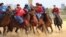 Kazakhstan (blue) prevailed as usual in kokpar, its version of goat-grabbing, by a score of 5-4 over Kyrgyzstan in the final at the World Nomad Games. 
