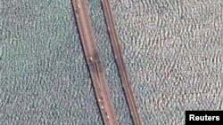 A satellite image shows a close-up view of the damaged span of the Crimea Bridge on July 17.