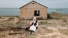 Cover for video - Woman in the village on the shores of the Caspian Sea. Photo by Ospan Ali 
