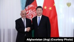 FILE: Afghan President Ashraf Ghani with his Chinese counterpart Xi Jinping in Kyrgyzstan in June 2019.
