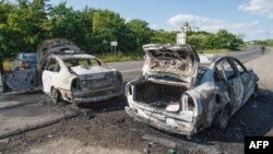 Спалені автомобілі на дорозі до Мукачева. 11 липня 2015 року