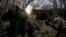 Ukrainian soldiers fire a self-propelled howitzer toward Russian troops at a frontline near the town of Chasiv Yar, Donetsk region, in January.