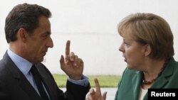 Ангела Меркель и Николя Саркози на встрече в Берлине 20 июля 2011 г