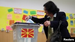 A woman votes during the presidential election in Skopje, North Macedonia, on April 24.