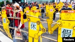 Protesti migrantskih radnika iz Filipina, Indonezije, Vijetnama i Tajlanda koji traže zaštitu zakonom o radu, kao i osnovna ljudska prava poput slobodnih dana, Taipei, decembar 2011. 