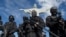 Бойцы BOPE, спецназа военной полиции Рио-де-Жанейро, на фоне знаменитой статуи Христа-Искупителя 