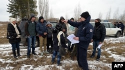 Serbian border police officers detained a group of Afghan asylum seekers as they tried to illegally cross the Serbian-Hungarian in February.