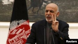 President Ashraf Ghani says Afghan forces will observe a cease-fire "provided that the Taliban participate." (file photo)