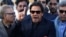 Imran Khan, chairman of the Pakistan Tehreek-e-Insaf (PTI) political party, addresses the media after the Supreme Court dismissed a petition to disqualify him from parliament for not declaring assets on December 15.