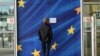 Belgium - A man looks at a sign announcing that a door is closed for security reasons at the European Commission’s Berlaymont building in Brussels, on September 22, 2014. 