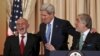 fghan President Ashraf Ghani (L) reacts as U.S. Secretary of State John Kerry (C) greets him and Chief Executive Abdullah Abdullah before a dinner at the State Department in Washington on March.