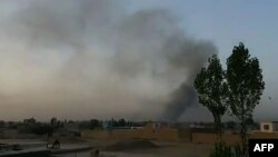 Smoke rises over the city of Ghazni after Taliban militants launched an attack on the Afghan provincial capital late on August 9. 