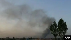 Smoke rises into the air after Taliban militants attacked the Afghan provincial capital, Ghazni.