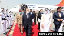 President Mohammad Ashraf Ghani arrives in Qatar on October 5.