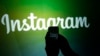 U.S. -- A journalist makes a video of the Instagram logo - generic