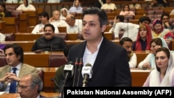 FILE: Hammad Azhar, Pakistan's minister of industries and production addressing the parliament in June 2019.