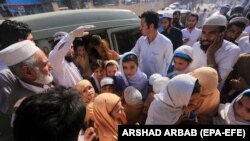 Children who complained of health issues after being administered polio vaccines are rushed to a hospital for treatment in Peshawar, Pakistan, on April 22.