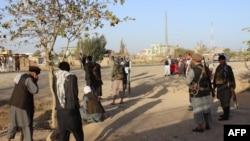FILE: Members of an Afghan during fighting between Taliban militants and Afghan security forces in Kunduz, October 2016.