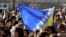 Croatia -- A girl waves a Bosnian flag in front of the prison uring the welcome ceremony for Bosnian Muslim Fikret Abdic in Pula, 09Mar2012