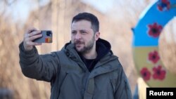 Ukrainian President Volodymyr Zelenskiy records a video to congratulate Ukrainian troops on Armed forces Day near the town of Slovyansk on December 6.