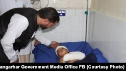 A child who was injured in the car-bomb attack in the Ghani Khail district of Nangarhar Province receives treatment in a hospital on October 3.