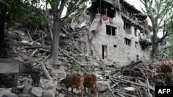 A house lays in ruins in eastern Afghanistan following a massive earthquake.