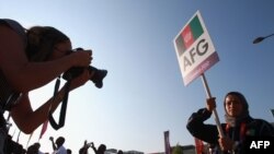 Athlete Tahmina Kohistani leads the Afghan team during the London Olympics in 2012.