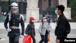 Turisti sa zaštitnim maskama, Taipei, Tajvan, mart, 2020. 