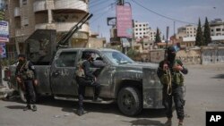 Pjesëtarë të forcave të sigurisë në Siri.