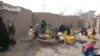 At the Minaret camp in Herat city, IDPs fetch water from the only existing water pump in the camp, which was built in the early 1990s.