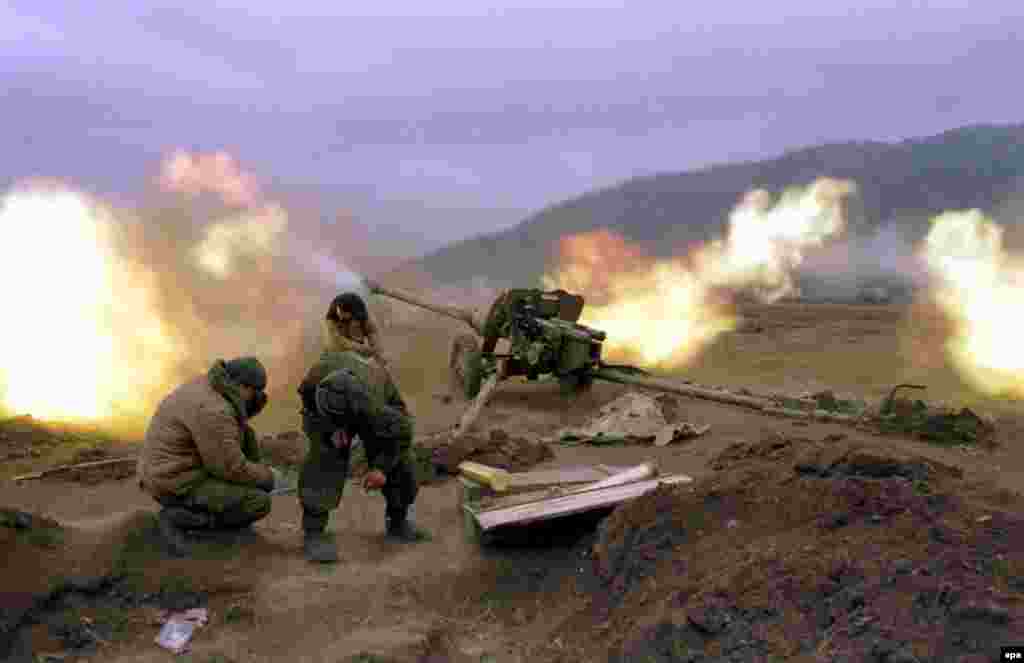 Russian federal soldiers fire at Chechen rebel positions. The ground assault was backed by heavy use of artillery and air power.