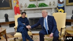 Președintele Donald Trump la primirea premierului pakistanez Imran Khan la Casa Albă, 22 iulie 2019. (Photo by Nicholas Kamm / AFP)