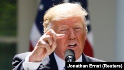 U.S. President Donald Trump takes questions while addressing a news conference in the Rose Garden at the White House in Washington, D.C., on June 9.