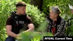 Current Time interviews Valentyna Oleksandrivna outside her apartment building that was damaged by a Russian air strike. 