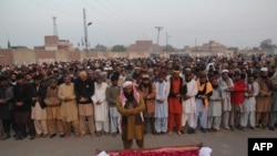 Relatives and residents offer funeral prayers for a executed prisoner in eastern Pakistan in January.